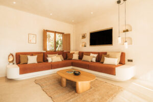 A living room with a sofa and a coffee table. | Ibiza